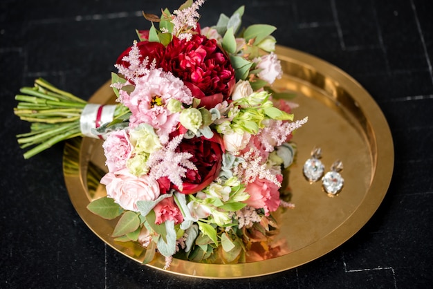 wedding bouquet on gold plate