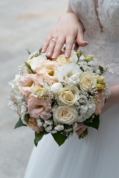 Wedding bouquet in the hands of the bride concept for event agencies