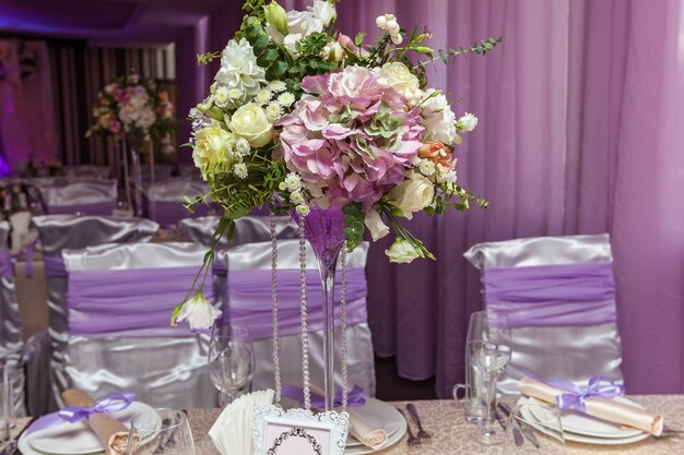 A wedding bouquet is on the table in the background of the hall. Bridal bouquet.