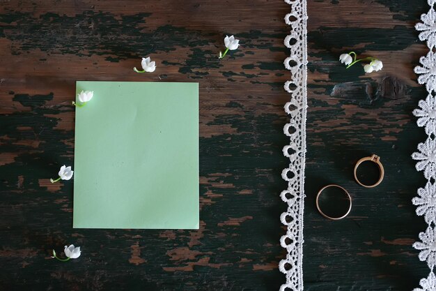 Wedding bouquet of lilies of the valley and rings