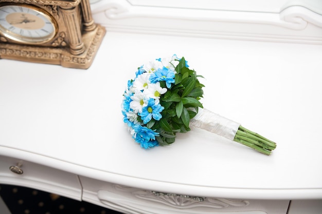 Wedding bouquet near a vintage clock