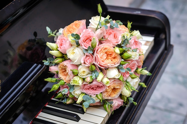 Wedding bouquet on piano keyboard