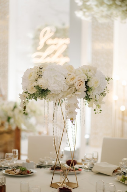 Wedding bouquet in restaurant on the table white flowers