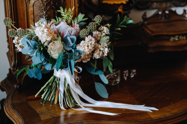 Wedding bouquet of roses lying on the surface. Wedding floristry