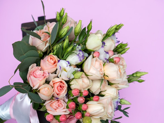 Wedding bouquet of soft pink Bush roses close-up, beautiful bouquet of the bride.