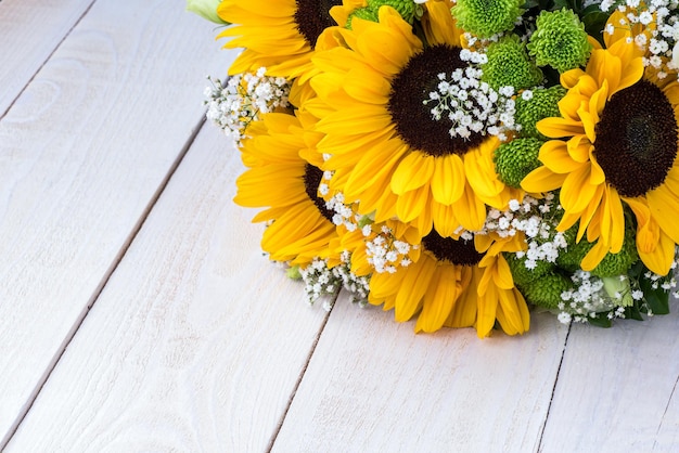 Wedding bouquet of sunflower on a wooden background Top view with copy space