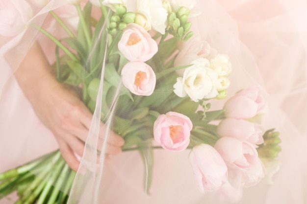 Wedding bouquet of tulips in bride's hands