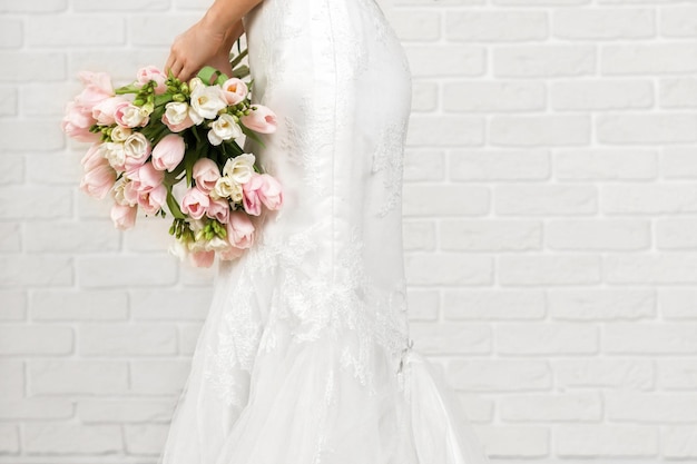 Wedding bouquet of tulips in bride's hands