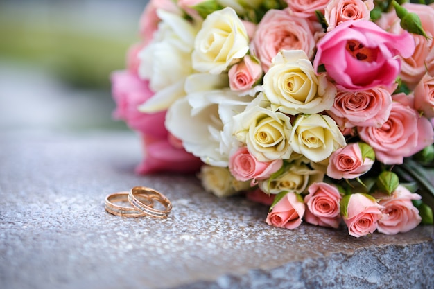 Wedding bouquet and wedding rings for bride and groom