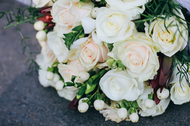 Wedding bouquet of white roses, white berries and protea