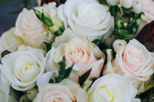 Wedding bouquet of white roses, white berries and protea