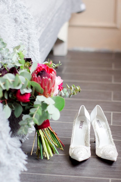 Wedding bouquet and white shoes