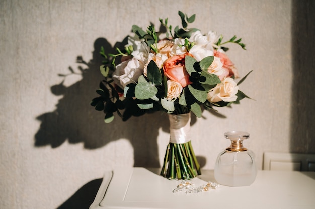 Wedding bouquet with roses on the table