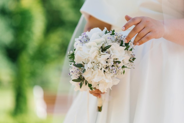 Premium Photo  Wedding bouquet with white hydrangea in the hands