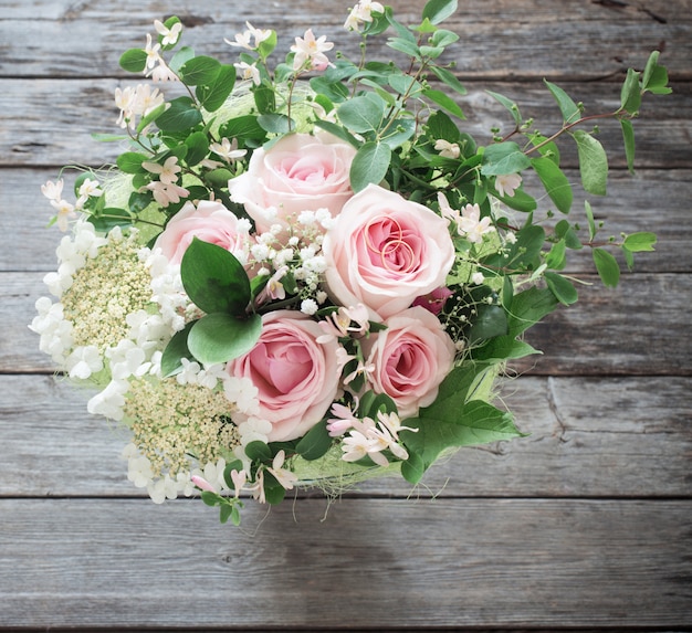 Wedding bouquet on wooden surface