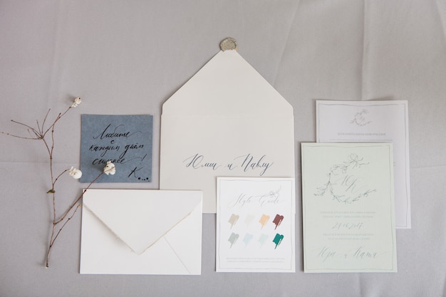 wedding calligraphy envelope and a letter with inscriptions in russian. translation: "love more every day" and " julia and paul"