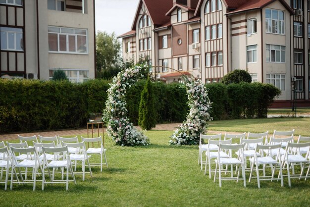 Wedding ceremony area arch chairs decor