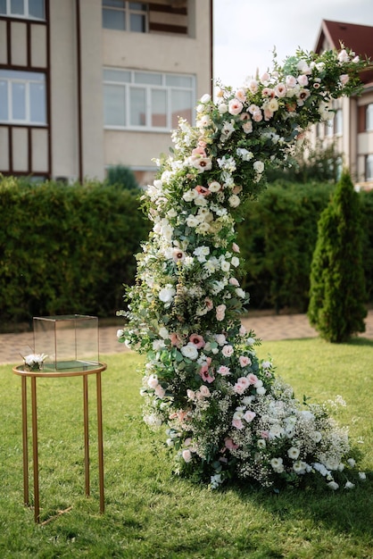 Wedding ceremony area arch chairs decor