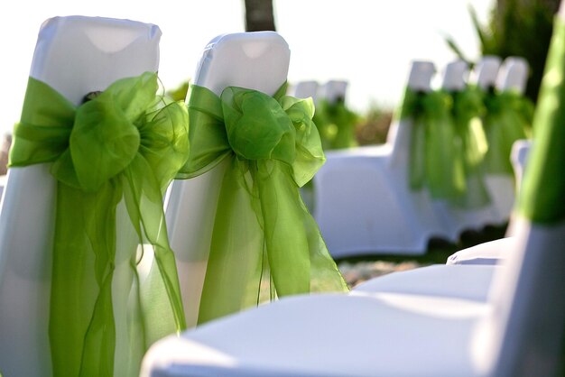 Photo wedding ceremony chairs with covers and bows