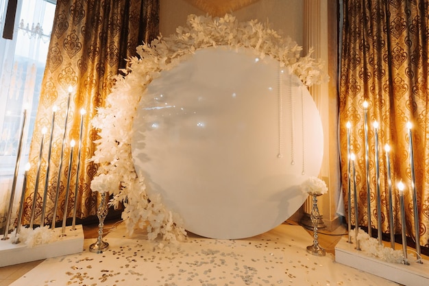 wedding ceremony in a closed room painting ceremony in the evening romantic painting the presidium is decorated with white flowers