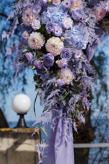 Wedding ceremony decorations closeup decor of arch decorated with crysanthemums roses hydrangeas and