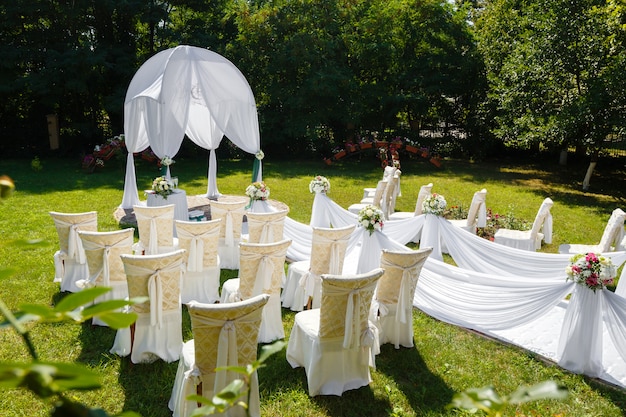 Wedding ceremony decorations in the park at sunny day