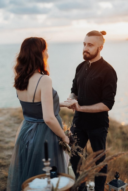 Wedding ceremony of a girl and a guy on high hills