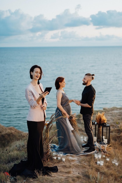 Wedding ceremony of a girl and a guy on high hills