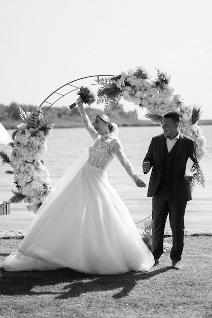 Wedding ceremony of the newlyweds on the pier