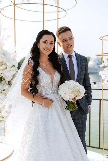 Wedding ceremony of the newlyweds on the pier