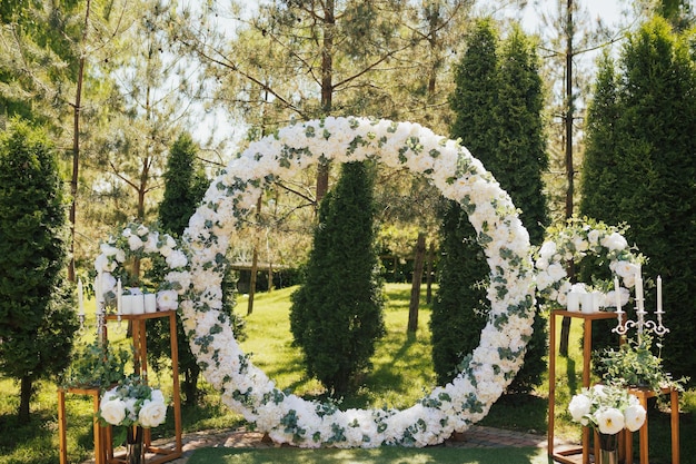 Wedding ceremony in the park in the sunny summer day