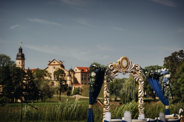 Wedding ceremony on the street on the green lawnDecor with fresh flowers arches for the ceremony