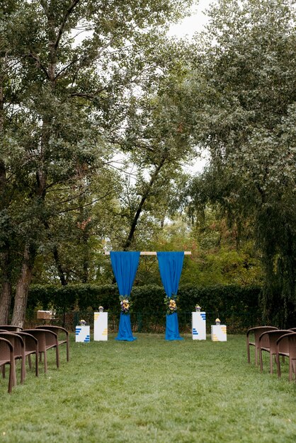 Wedding ceremony in the woods among the trees on the green track