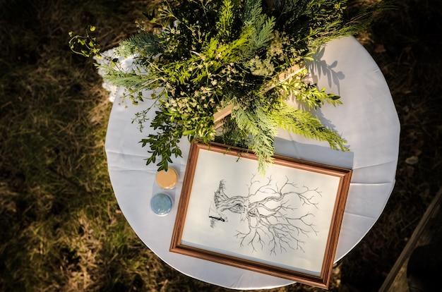 Wedding ceremony in the woods among the trees on the green track