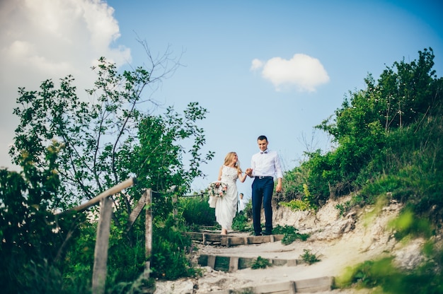 Wedding couple in a forest in the mountains