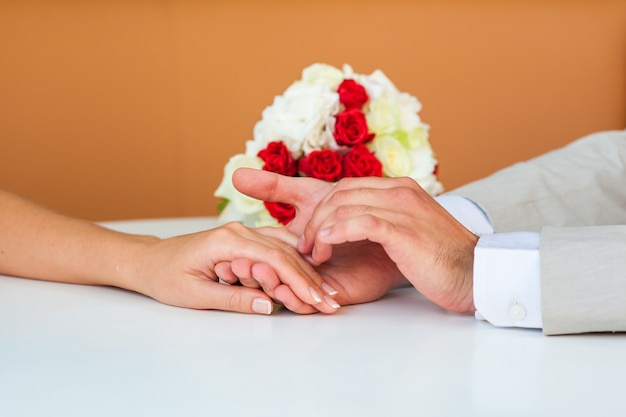 Wedding couple holding hands. bride and groom