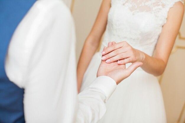 Wedding couple holding hands. bride and groom