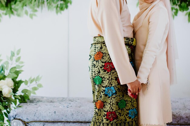 Wedding couple holding hands