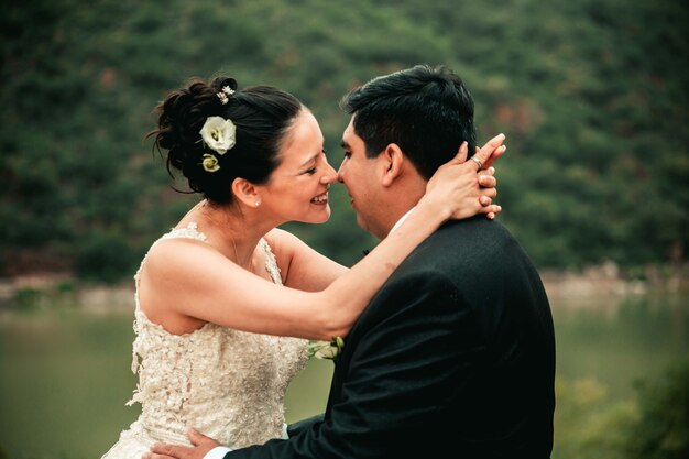 Wedding couple just married in green landscape in the mountains