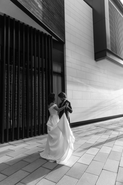 Wedding couple kissing City. Dawn. Wedding dress. Bride &amp; groom.