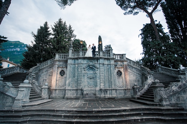 Wedding couple kissing the top of the stairs