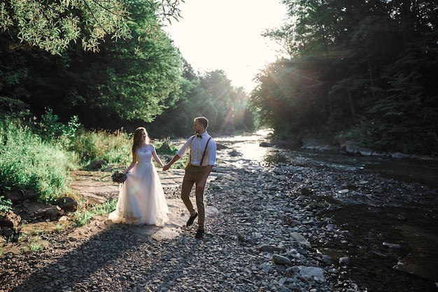 Wedding couple near river