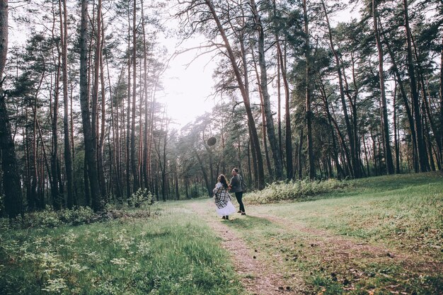 Wedding couple in pine forest