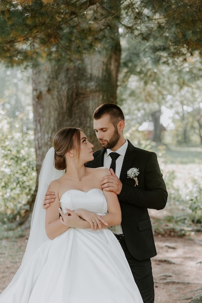 Wedding couple in pine forest