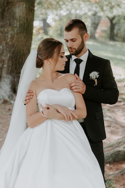 Wedding couple in pine forest