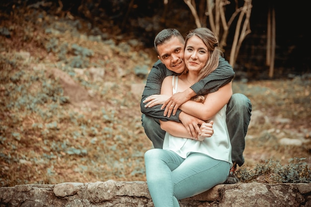 Wedding couple posing together in nature