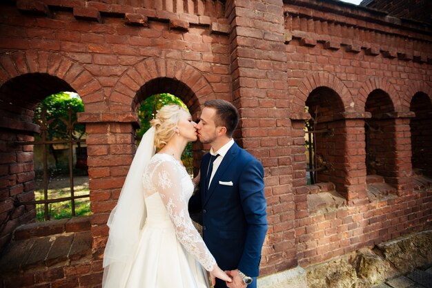 Wedding couple walking on streets of city