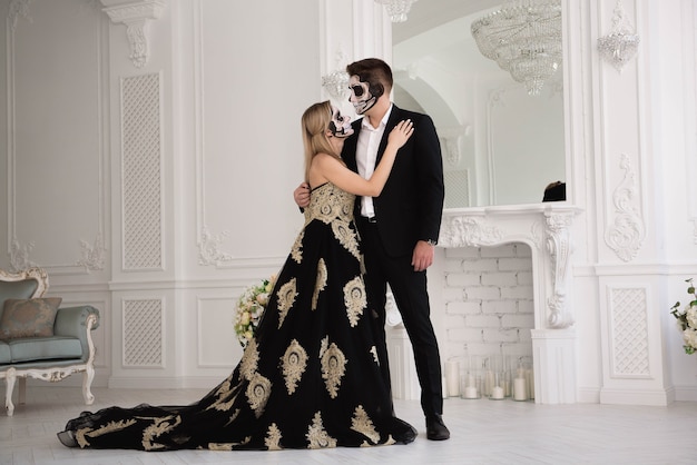 A wedding couple with skeleton make up for Halloween or All Souls Day