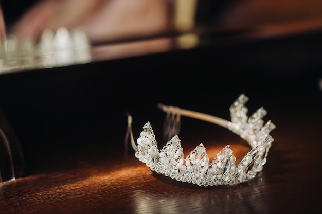 The wedding crown for the bride is on the table