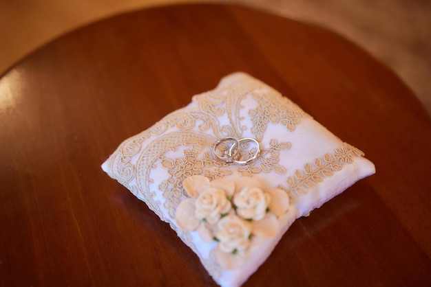 Wedding day two rings on the small decorative pillow